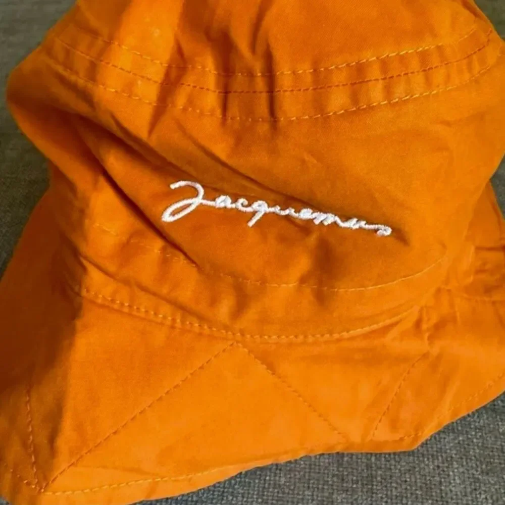 Jacquemus orange logo bucket hat seen on Hailey size56